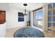 Bright dining room with blue accents and balcony access at 231 Riverside Drive # 101-1, Holly Hill, FL 32117