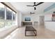 Living room with large windows and a modern coffee table at 231 Riverside Drive # 101-1, Holly Hill, FL 32117