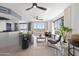 Bright living room with water views and modern furniture at 231 Riverside Drive # 101-1, Holly Hill, FL 32117