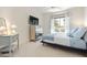 Bright bedroom with a double bed and a small side table at 231 Riverside Drive # 101-1, Holly Hill, FL 32117