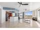 Open concept kitchen with breakfast bar and stainless steel appliances at 231 Riverside Drive # 101-1, Holly Hill, FL 32117
