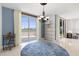 Bright dining room with water views and modern chandelier at 231 Riverside Drive # 101-1, Holly Hill, FL 32117