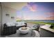 Evening view from balcony with fire pit and seating at 231 Riverside Drive # 101-1, Holly Hill, FL 32117