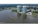 Aerial view of twin waterfront towers with marina access at 231 Riverside Drive # 101-1, Holly Hill, FL 32117