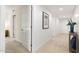 Clean and spacious hallway with light walls and tile flooring at 231 Riverside Drive # 101-1, Holly Hill, FL 32117