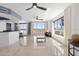 Bright living room with water views and modern furniture at 231 Riverside Drive # 101-1, Holly Hill, FL 32117