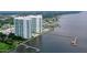 Aerial view of waterfront property with two towers and marina at 231 Riverside Drive # 101-1, Holly Hill, FL 32117