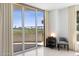 Living area with sliding doors leading to balcony and water view at 231 Riverside Drive # 101-1, Holly Hill, FL 32117