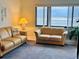 Living room with ocean view and comfy furniture at 4175 S Atlantic Ave # 1020, New Smyrna Beach, FL 32169