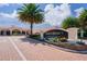 Shanmuketan 2 community entrance with landscaping and brick pavers at 332 David Walker Dr # J-2, Tavares, FL 32778