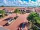 Aerial view of Shanmuketan 2 community with lush landscaping at 332 David Walker Dr # J-2, Tavares, FL 32778