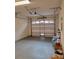 Attached garage with automatic door opener and painted floor at 332 David Walker Dr # J-2, Tavares, FL 32778