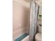 Clean bathroom with tub and shower, beach-themed decor at 3700 S Atlantic Ave # 407, New Smyrna Beach, FL 32169