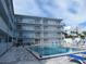Enjoy this refreshing community pool and patio area at 3700 S Atlantic Ave # 407, New Smyrna Beach, FL 32169