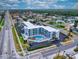 Aerial view of building, pool, parking and surrounding area at 3700 S Atlantic Ave # 407, New Smyrna Beach, FL 32169