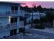 Evening ocean view from balcony, showing street and homes at 3700 S Atlantic Ave # 407, New Smyrna Beach, FL 32169