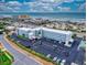 Oceanfront property aerial view showing building, parking, and beach at 3700 S Atlantic Ave # 407, New Smyrna Beach, FL 32169