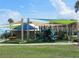 playground with shade structures and play equipment at 3700 S Atlantic Ave # 407, New Smyrna Beach, FL 32169