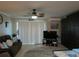 Living room with seating, TV, and ocean views at 3700 S Atlantic Ave # 407, New Smyrna Beach, FL 32169