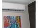 AC unit with digital thermostat and Venice-themed artwork at 3700 S Atlantic Ave # 407, New Smyrna Beach, FL 32169
