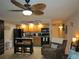 Well-equipped kitchen featuring wood cabinets, black appliances, and a breakfast bar at 3700 S Atlantic Ave # 407, New Smyrna Beach, FL 32169