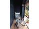 Peaceful screened porch with rocking chair and potted plants at 2019 Jaffa Ct, Clermont, FL 34714