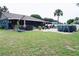 Large backyard with hot tub, above ground pool, and patio at 2019 Jaffa Ct, Clermont, FL 34714