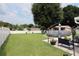 Large backyard with grassy lawn, above ground pool, and patio at 2019 Jaffa Ct, Clermont, FL 34714