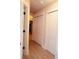 Bright hallway with white closets and tile floor at 2019 Jaffa Ct, Clermont, FL 34714