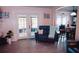 Living room with French doors opening to a screened porch at 2019 Jaffa Ct, Clermont, FL 34714