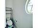 Small bathroom with toilet and shelving at 13880 Arclid St, Orlando, FL 32832