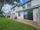 Private backyard with grass, patio, and AC units at 13880 Arclid St, Orlando, FL 32832