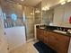 Bathroom with double vanity and large shower at 13880 Arclid St, Orlando, FL 32832