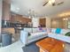 Open concept kitchen with island, stainless steel appliances, and wooden cabinets at 13880 Arclid St, Orlando, FL 32832