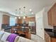 Modern kitchen with stainless steel appliances and an island at 13880 Arclid St, Orlando, FL 32832