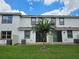 Private backyard with grass, patio, and AC units at 13880 Arclid St, Orlando, FL 32832