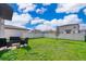 Landscaped backyard with patio furniture and privacy fence at 2370 Brassie Ct, Winter Haven, FL 33884
