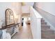 Bright and spacious entryway with staircase and console table at 2370 Brassie Ct, Winter Haven, FL 33884