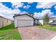 Two-story house with a two-car garage and landscaped front yard at 2370 Brassie Ct, Winter Haven, FL 33884