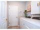 Laundry room with Whirlpool washer and dryer at 2370 Brassie Ct, Winter Haven, FL 33884