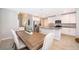 Kitchen dining area with wood table and white chairs at 2370 Brassie Ct, Winter Haven, FL 33884