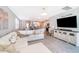 Living room with sectional sofa and large TV at 2370 Brassie Ct, Winter Haven, FL 33884