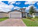 Two-story house with a modern facade and landscaped yard at 2370 Brassie Ct, Winter Haven, FL 33884