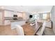 Open kitchen with island, granite countertops, and stainless steel appliances at 2370 Brassie Ct, Winter Haven, FL 33884