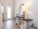 Elegant entryway with console table and mirror at 2370 Brassie Ct, Winter Haven, FL 33884