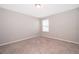 Simple bedroom with carpeted floor and window at 2370 Brassie Ct, Winter Haven, FL 33884