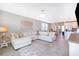 Open concept living room with sectional sofa and view of kitchen at 2370 Brassie Ct, Winter Haven, FL 33884