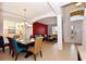 Open dining room with chandelier and seating for six at 401 Cabello Dr, Davenport, FL 33837