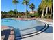 Community pool with a relaxing patio area at 401 Cabello Dr, Davenport, FL 33837