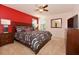 Spacious bedroom with king bed, nightstands, and TV at 401 Cabello Dr, Davenport, FL 33837